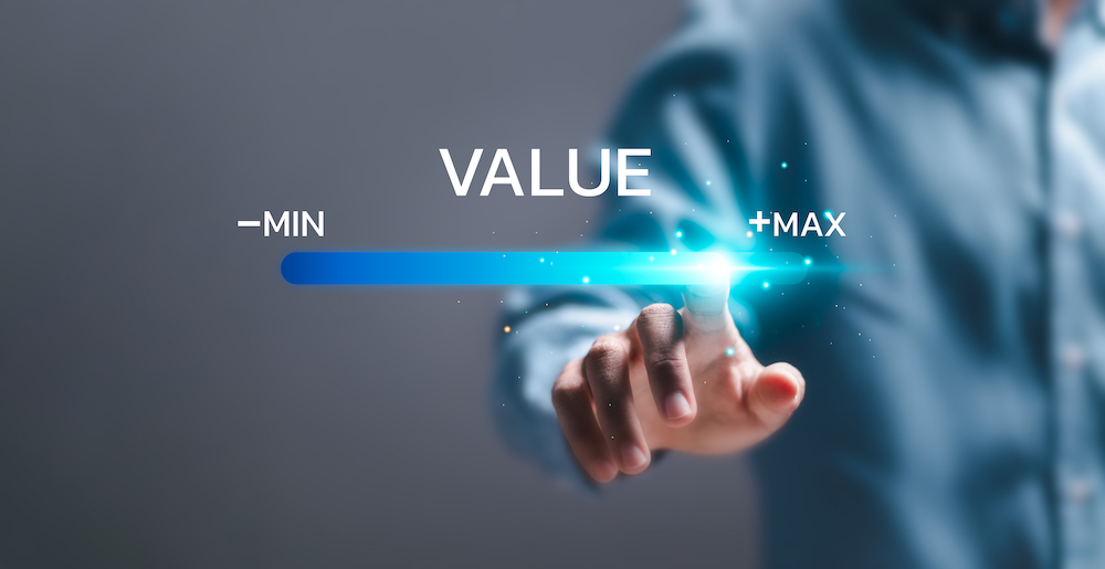 Businessman touch virtual screen of progress bar with the word VALUE for growth value, increase value, value added and business growth concept.